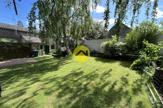 Maison 7 pièces avec jardin.