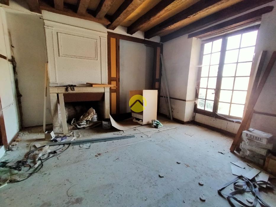 magasin avec  tour en  pierres