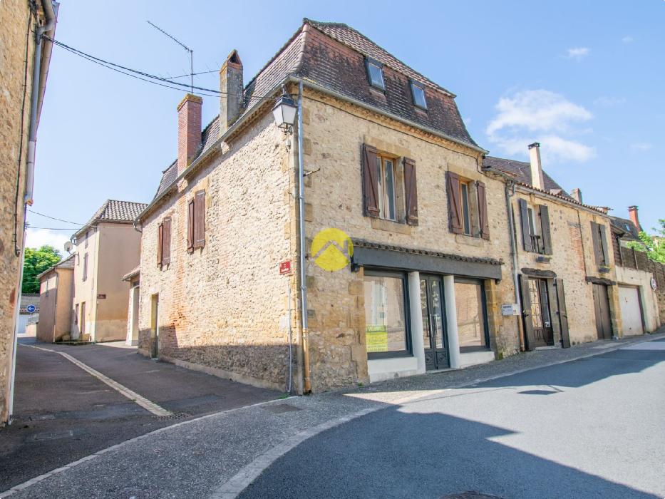 Immeuble avec commerce et app. 2 ch