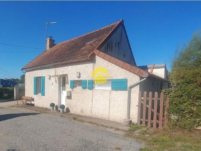 Maison avec un grand garage