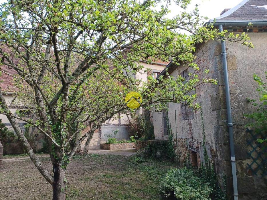 2 maisons avec garage et jardin